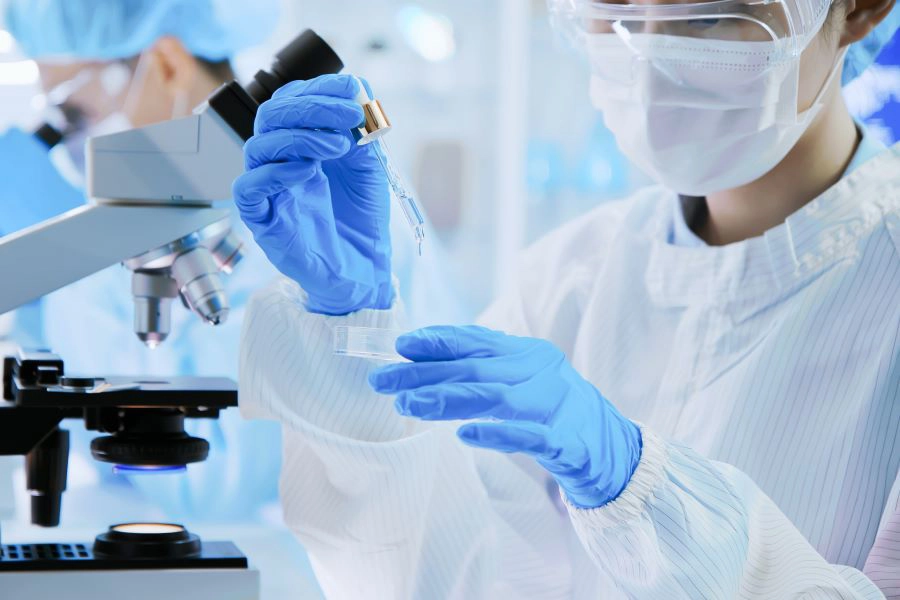 Researcher testing a natural extract in a lab